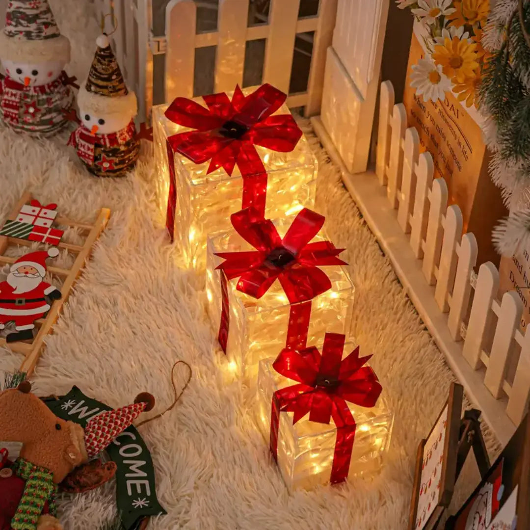 Lumora Lighted Christmas Gift Boxes - Transparent Warm White LED Present Decorations with Red Bows